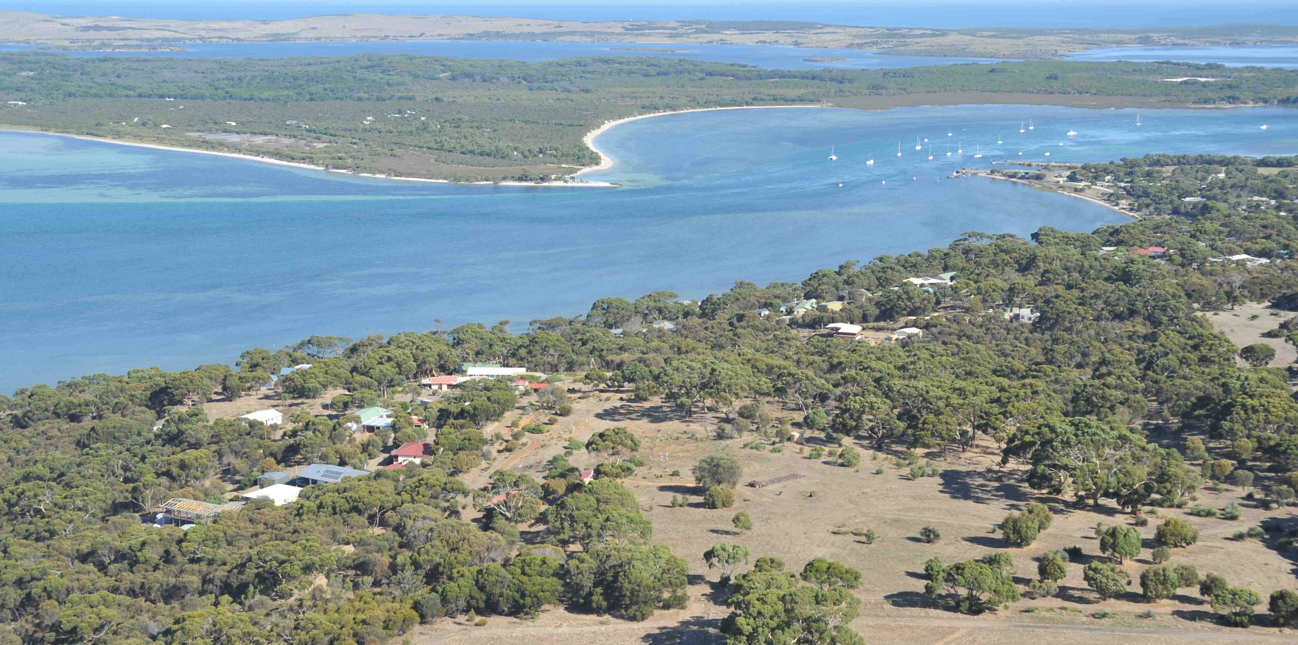 Aerial view on Buddhâyatana and Pelican Lagoon, with the Southern Ocean at the horizon